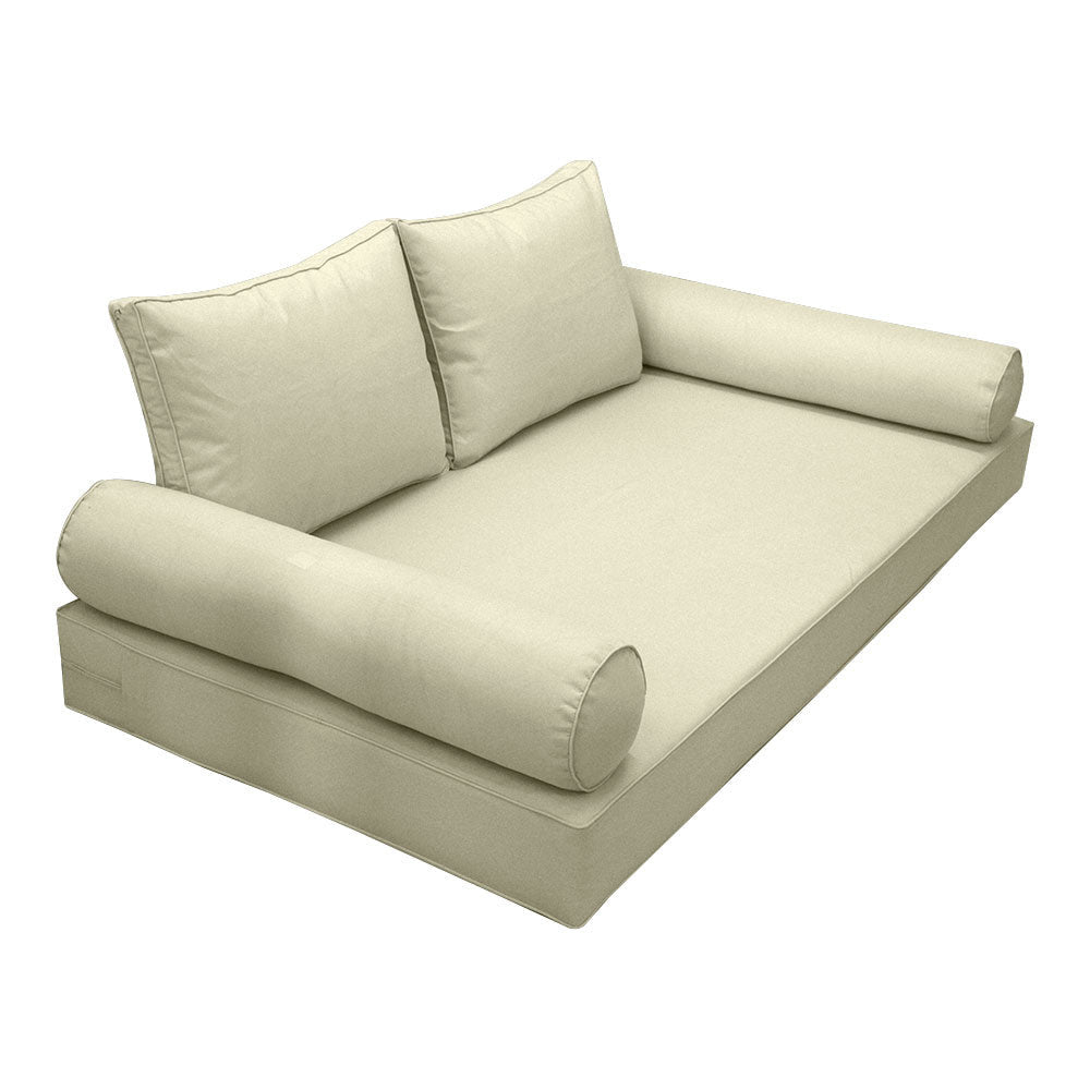 Elegant cushion and bolster set featuring refined craftsmanship and knife-edge detailing, designed for versatile indoor and outdoor comfort.