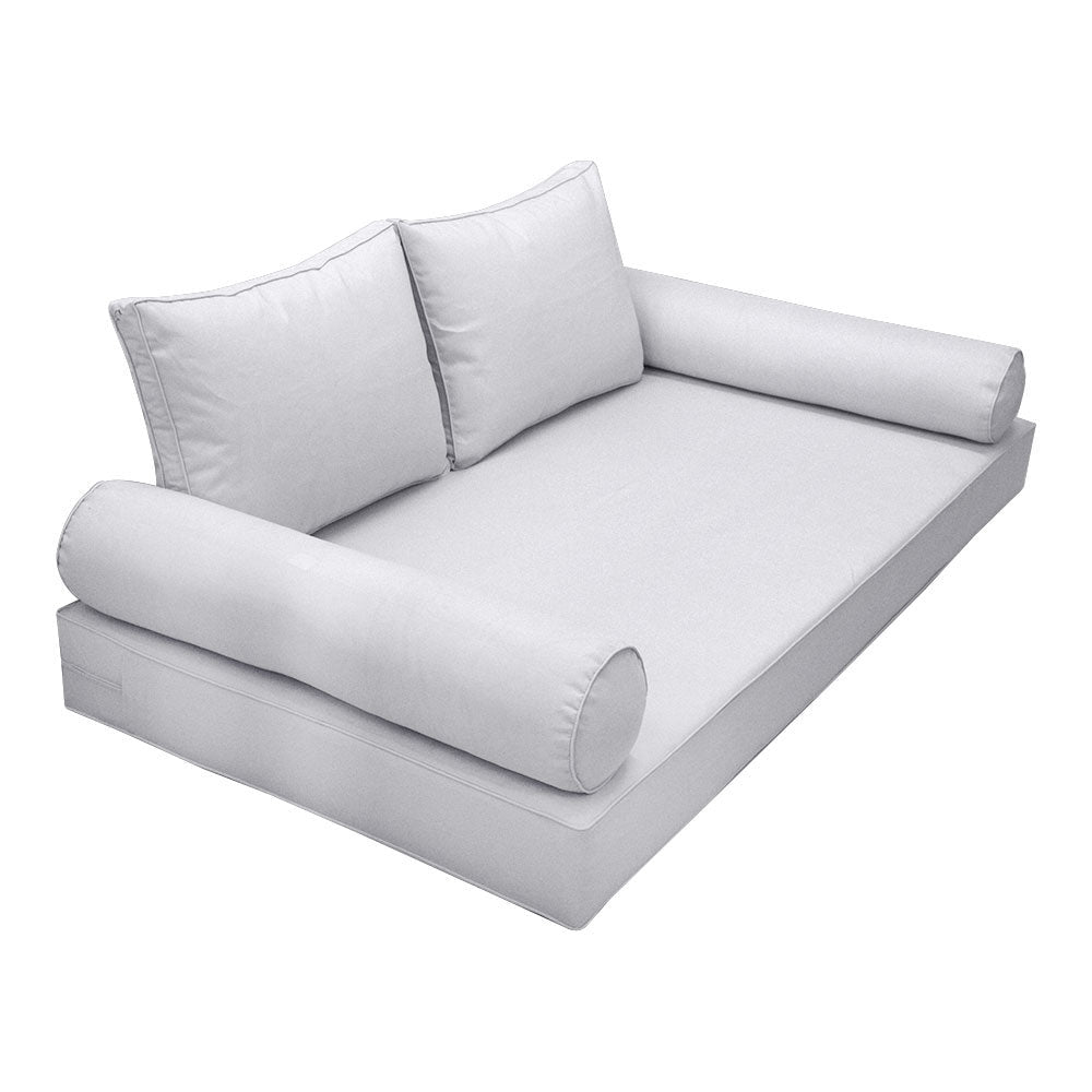 Elegant cushion and bolster set featuring refined craftsmanship and knife-edge detailing, designed for versatile indoor and outdoor comfort.