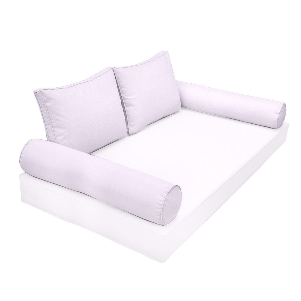 Elegant cushion and bolster set featuring refined craftsmanship and knife-edge detailing, designed for versatile indoor and outdoor comfort.