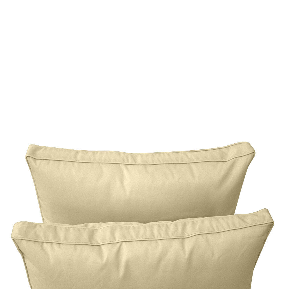 Pillow and bolster cushions displayed on an outdoor porch swing for a cozy, elegant setting.