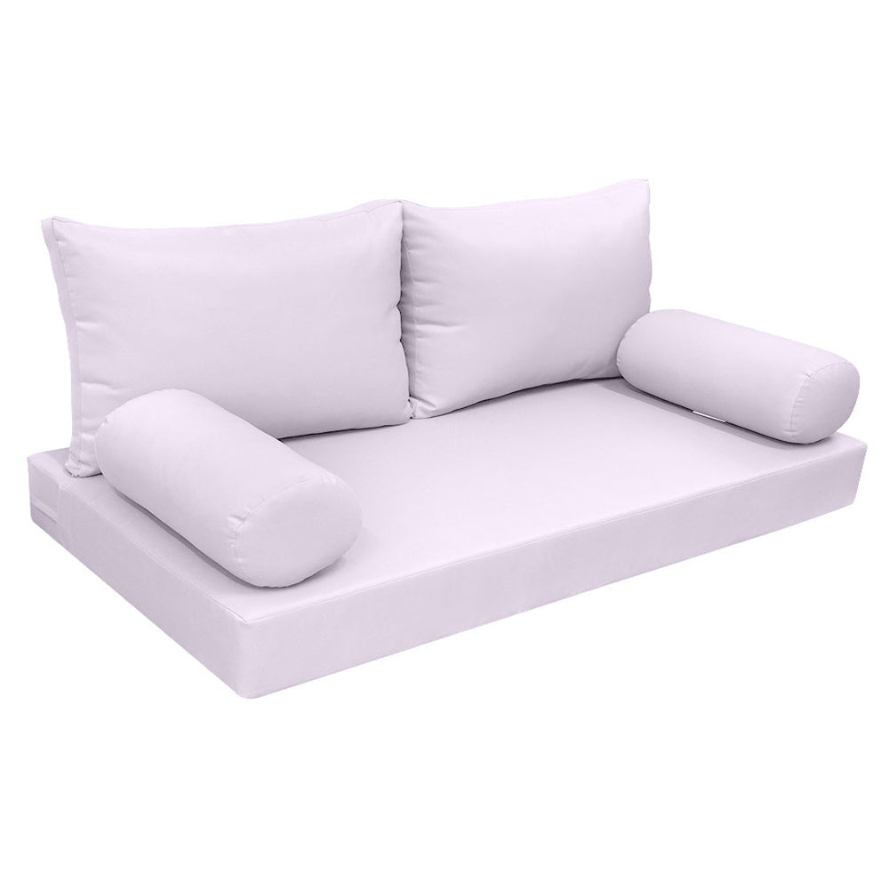 Elegant cushion and bolster set featuring refined craftsmanship and knife-edge detailing, designed for versatile indoor and outdoor comfort