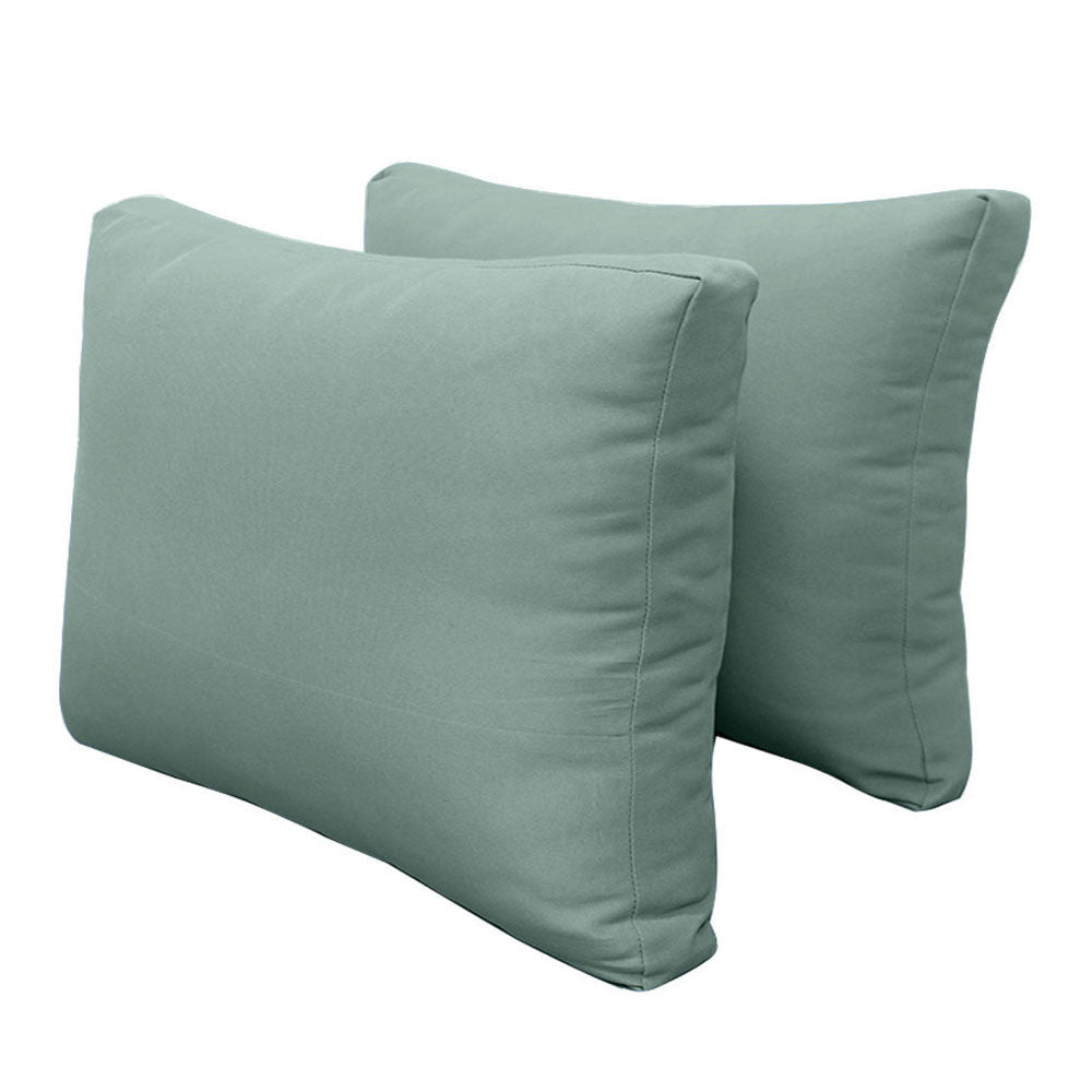 Pillow and bolster cushions displayed on an outdoor porch swing for a cozy, elegant setting.