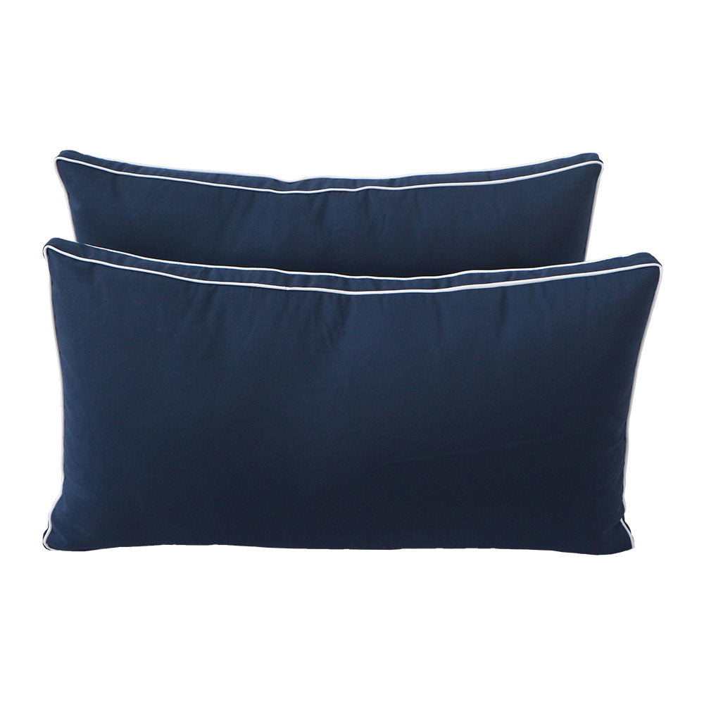 Pillow and bolster cushions displayed on an outdoor porch swing for a cozy, elegant setting.
