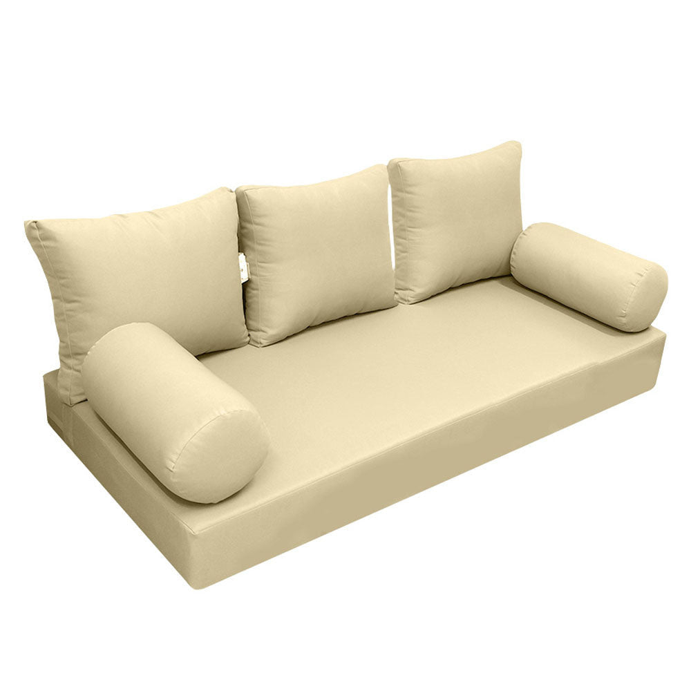 Elegant cushion and bolster set featuring refined craftsmanship and knife-edge detailing, designed for versatile indoor and outdoor comfort