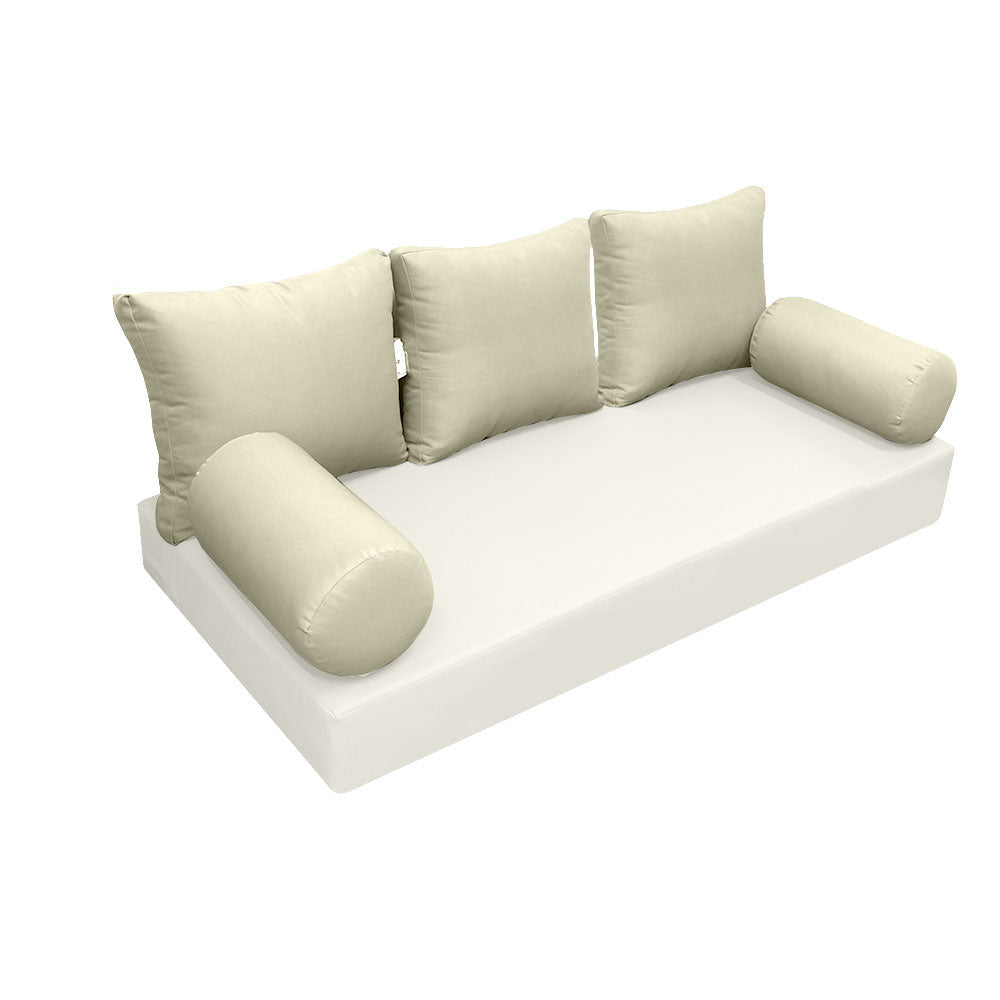 Elegant cushion and bolster set featuring refined craftsmanship and knife-edge detailing, designed for versatile indoor and outdoor comfort