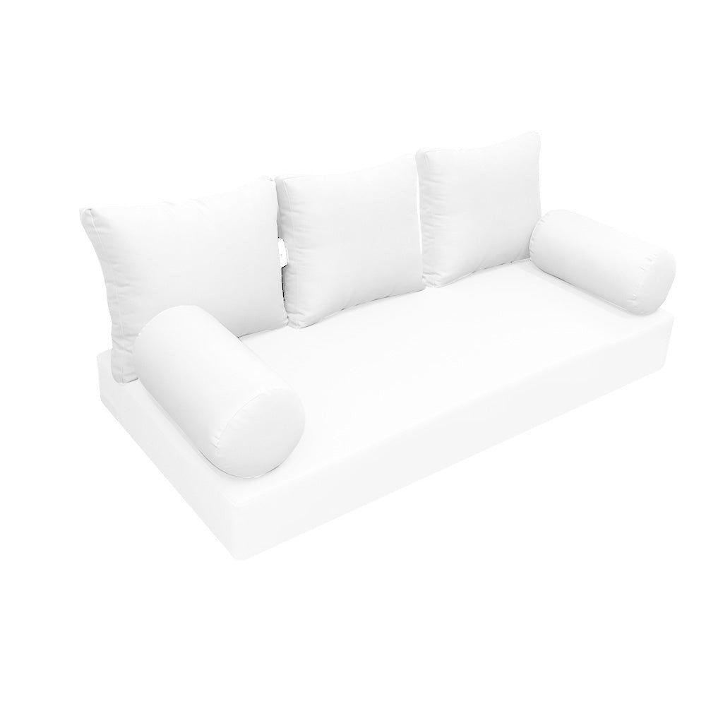 Elegant cushion and bolster set featuring refined craftsmanship and knife-edge detailing, designed for versatile indoor and outdoor comfort