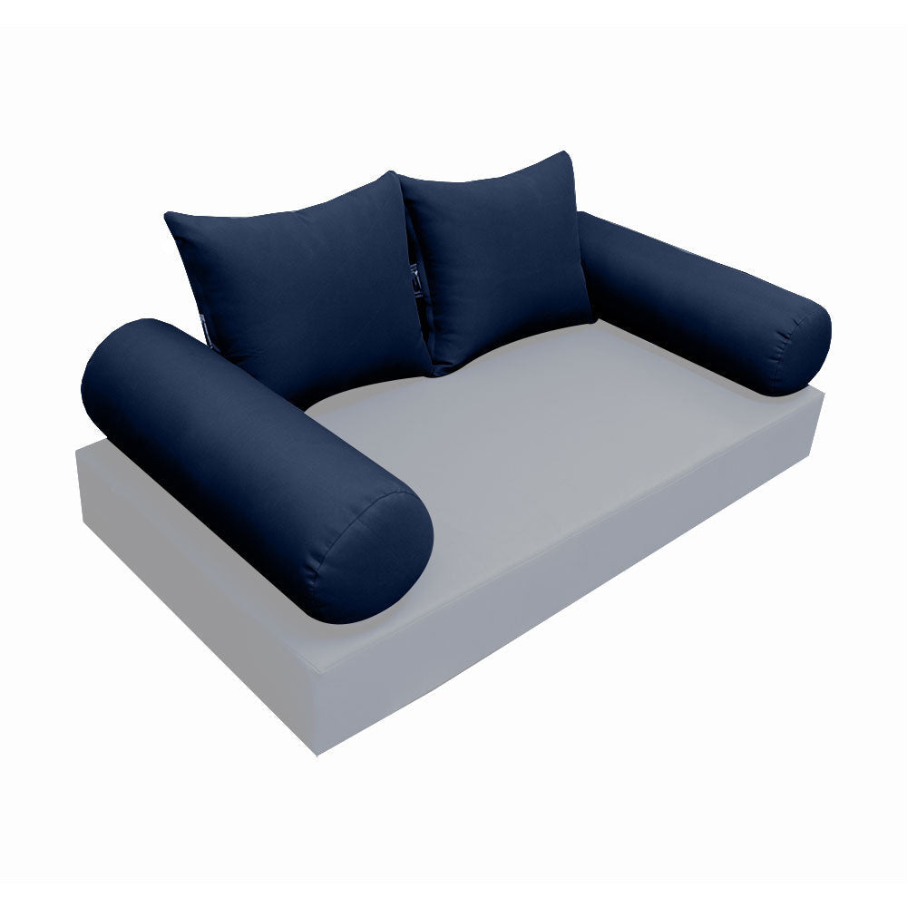 Elegant cushion and bolster set featuring refined craftsmanship and knife-edge detailing, designed for versatile indoor and outdoor comfort.