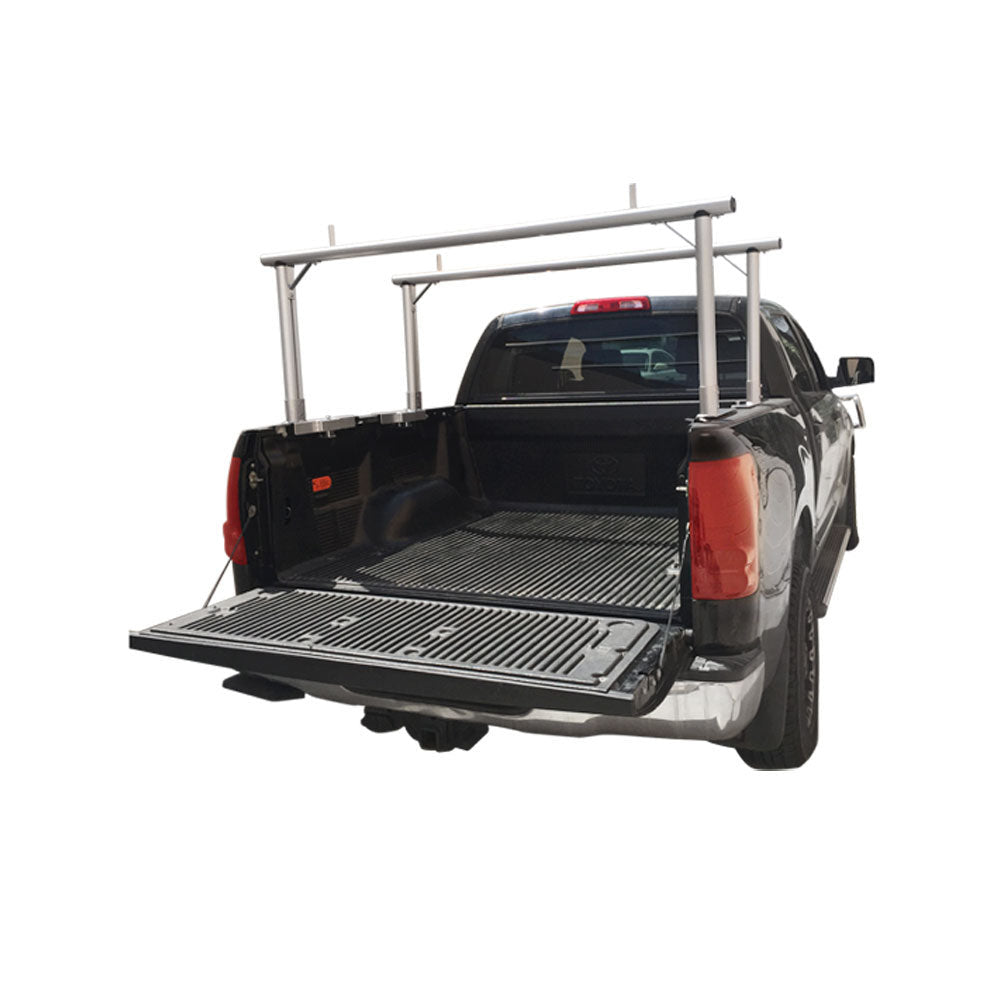 Black pickup truck with universal aluminum ladder rack installed in the bed