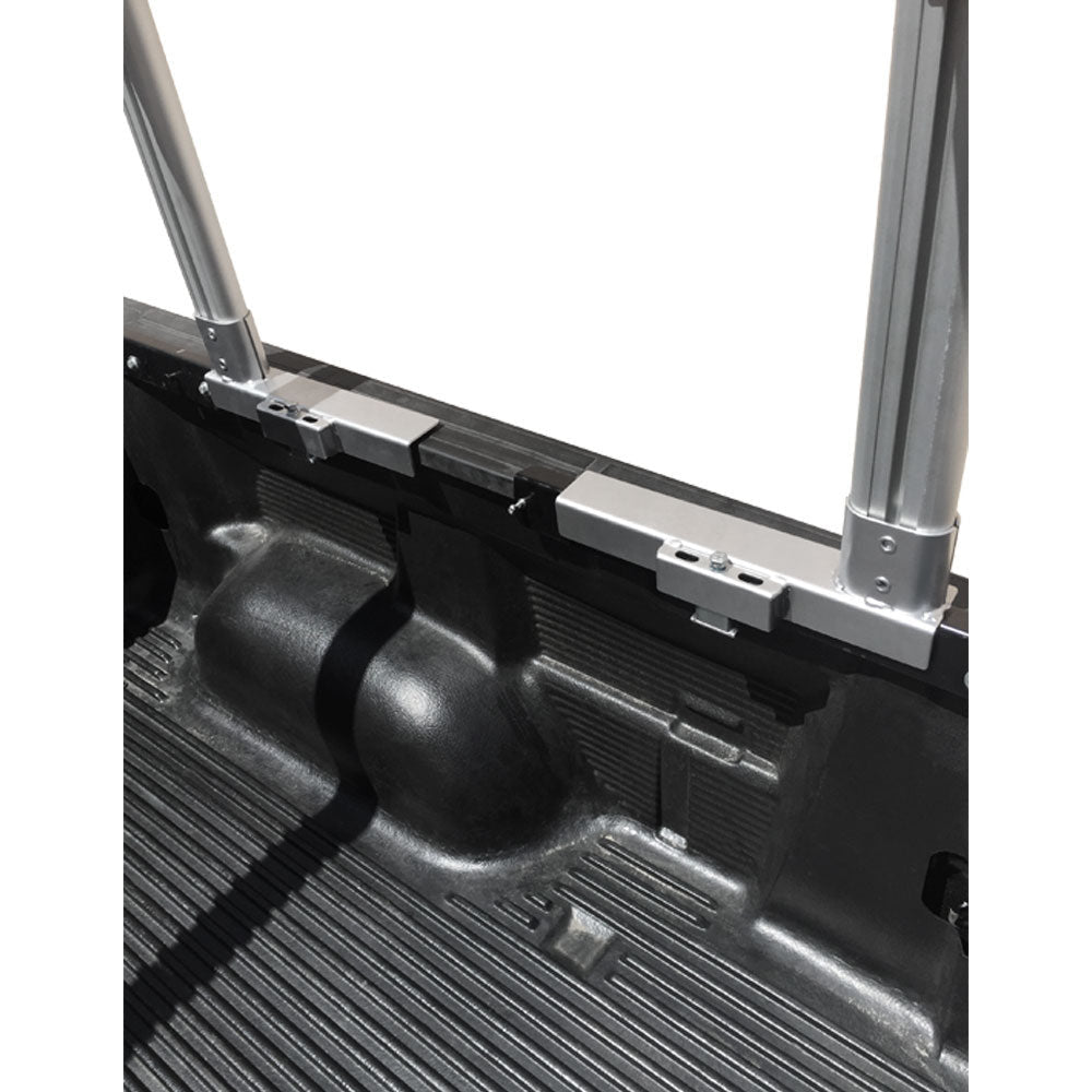 Rear view of pickup with silver aluminum truck rack and open tailgate