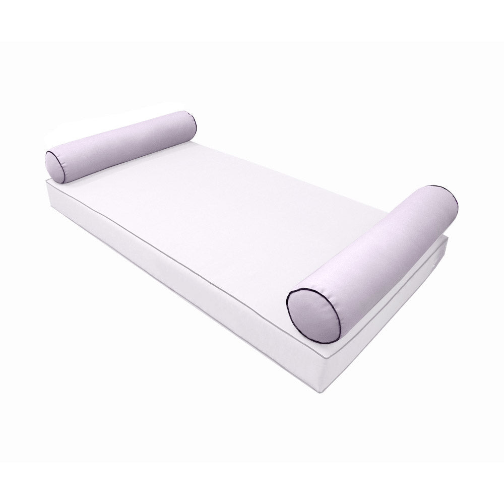 Elegant cushion and bolster set featuring refined craftsmanship and knife-edge detailing, designed for versatile indoor and outdoor comfort.