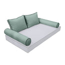 Elegant cushion and bolster set featuring refined craftsmanship and knife-edge detailing, designed for versatile indoor and outdoor comfort.