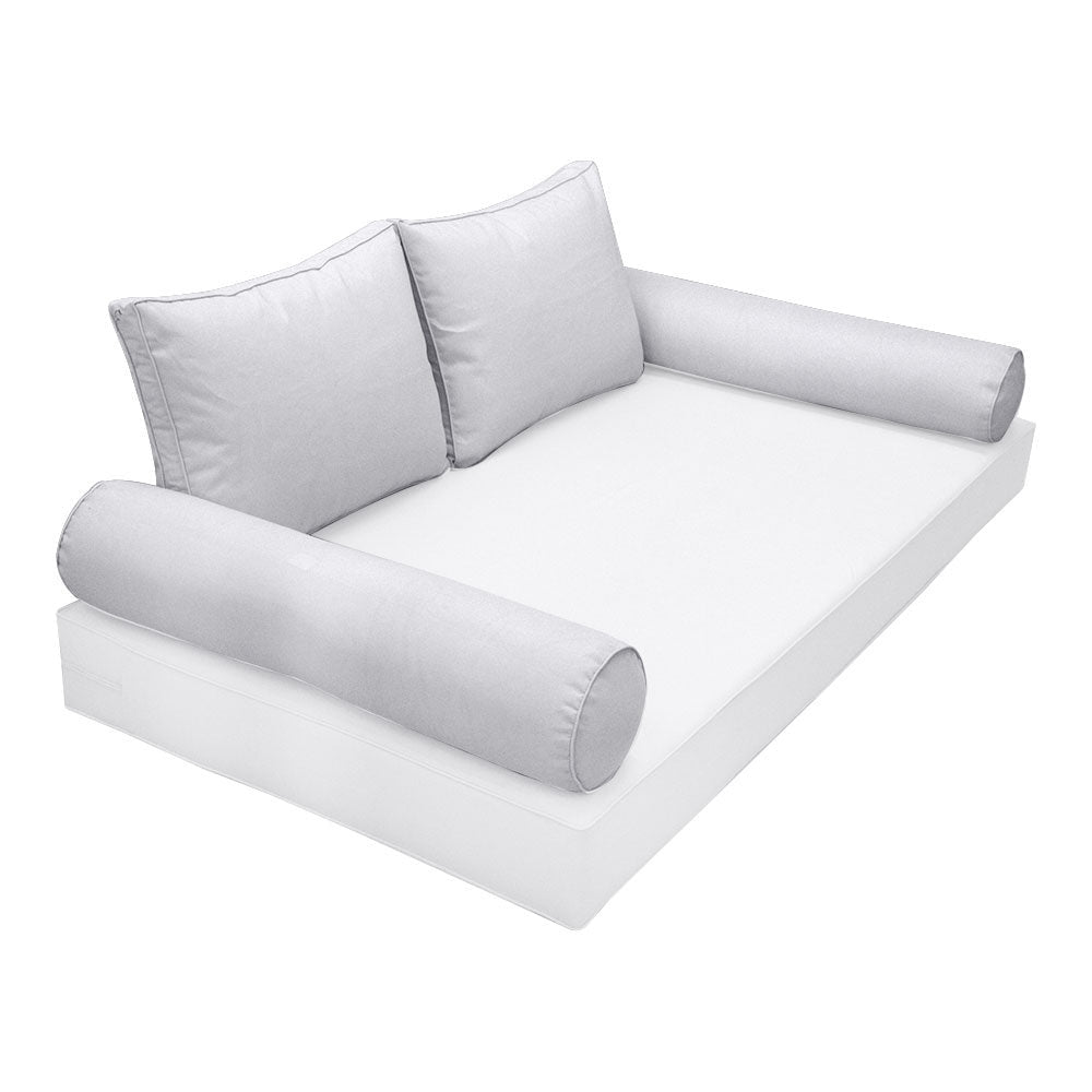 Elegant cushion and bolster set featuring refined craftsmanship and knife-edge detailing, designed for versatile indoor and outdoor comfort.
