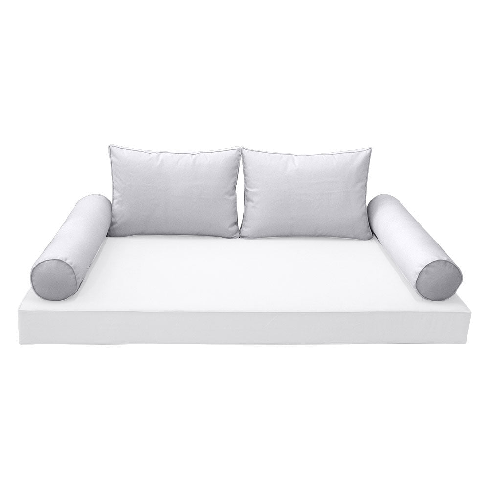 Elegant cushion and bolster set featuring refined craftsmanship and knife-edge detailing, designed for versatile indoor and outdoor comfort.
