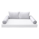 Elegant cushion and bolster set featuring refined craftsmanship and knife-edge detailing, designed for versatile indoor and outdoor comfort.
