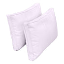 Pillow and bolster cushions displayed on an outdoor porch swing for a cozy, elegant setting.
