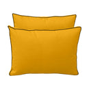 Pillow and bolster cushions displayed on an outdoor porch swing for a cozy, elegant setting.