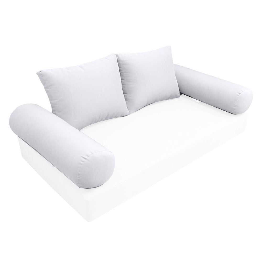 Elegant cushion and bolster set featuring refined craftsmanship and knife-edge detailing, designed for versatile indoor and outdoor comfort