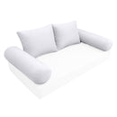 Elegant cushion and bolster set featuring refined craftsmanship and knife-edge detailing, designed for versatile indoor and outdoor comfort
