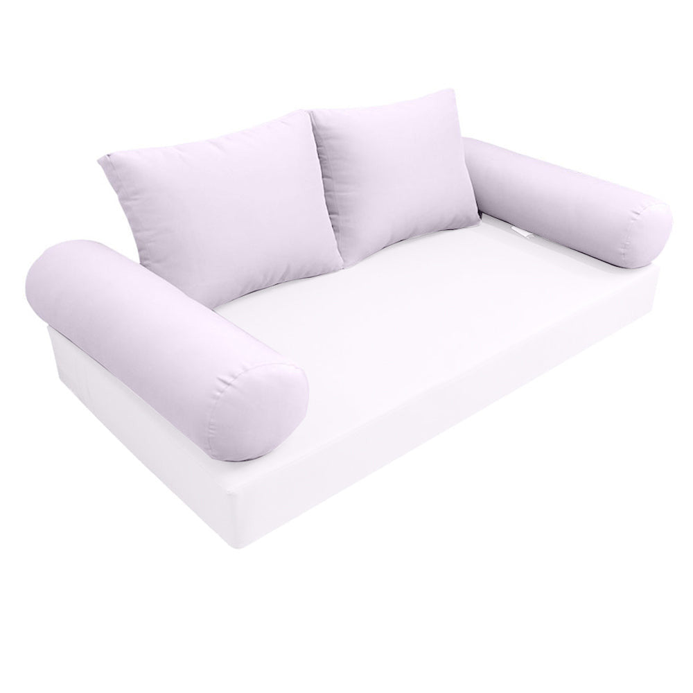  Elegant cushion and bolster set featuring refined craftsmanship and knife-edge detailing, designed for versatile indoor and outdoor comfort
