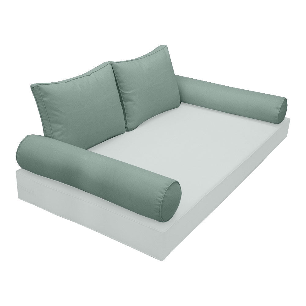Elegant cushion and bolster set featuring refined craftsmanship and knife-edge detailing, designed for versatile indoor and outdoor comfort.
