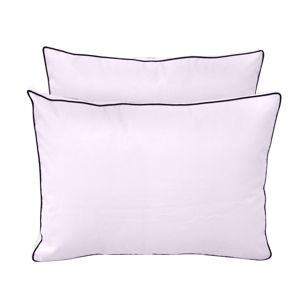 Pillow and bolster cushions displayed on an outdoor porch swing for a cozy, elegant setting.