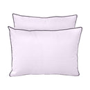 Pillow and bolster cushions displayed on an outdoor porch swing for a cozy, elegant setting.