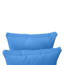 Pillow and bolster cushions displayed on an outdoor porch swing for a cozy, elegant setting.
