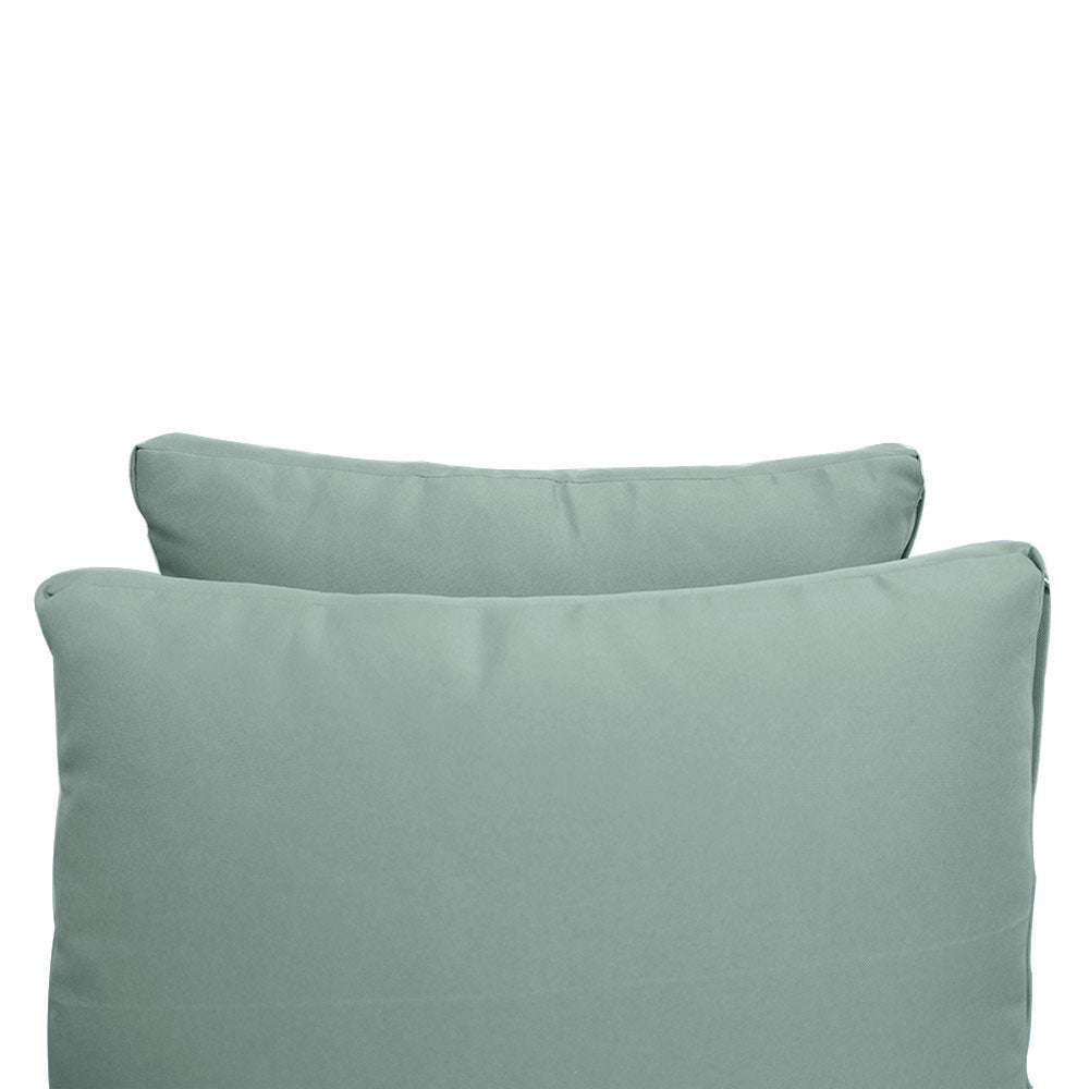 Pillow and bolster cushions displayed on an outdoor porch swing for a cozy, elegant setting