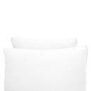 Pillow and bolster cushions displayed on an outdoor porch swing for a cozy, elegant setting