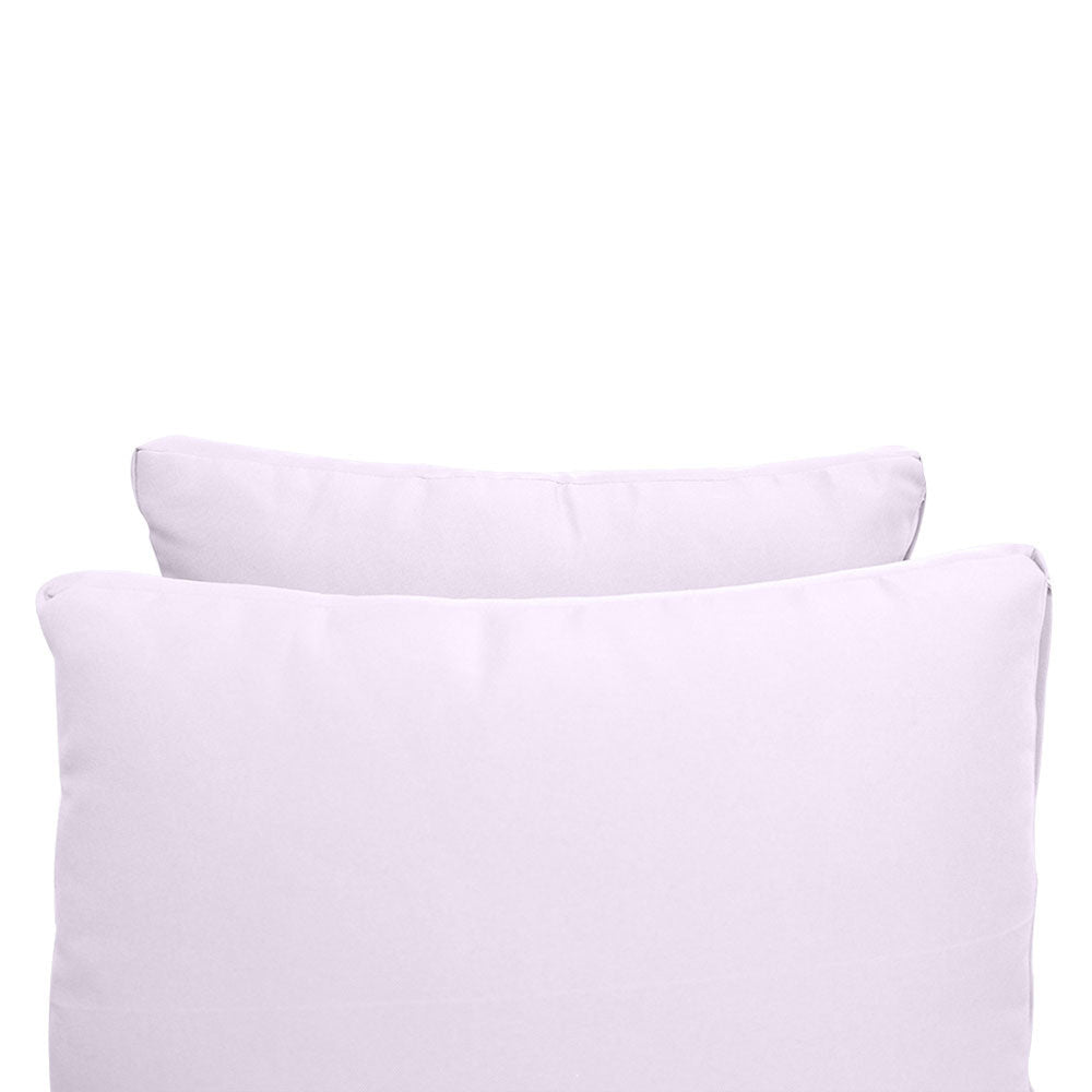 Pillow and bolster cushions displayed on an outdoor porch swing for a cozy, elegant setting