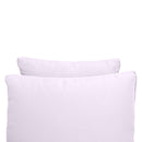 Pillow and bolster cushions displayed on an outdoor porch swing for a cozy, elegant setting