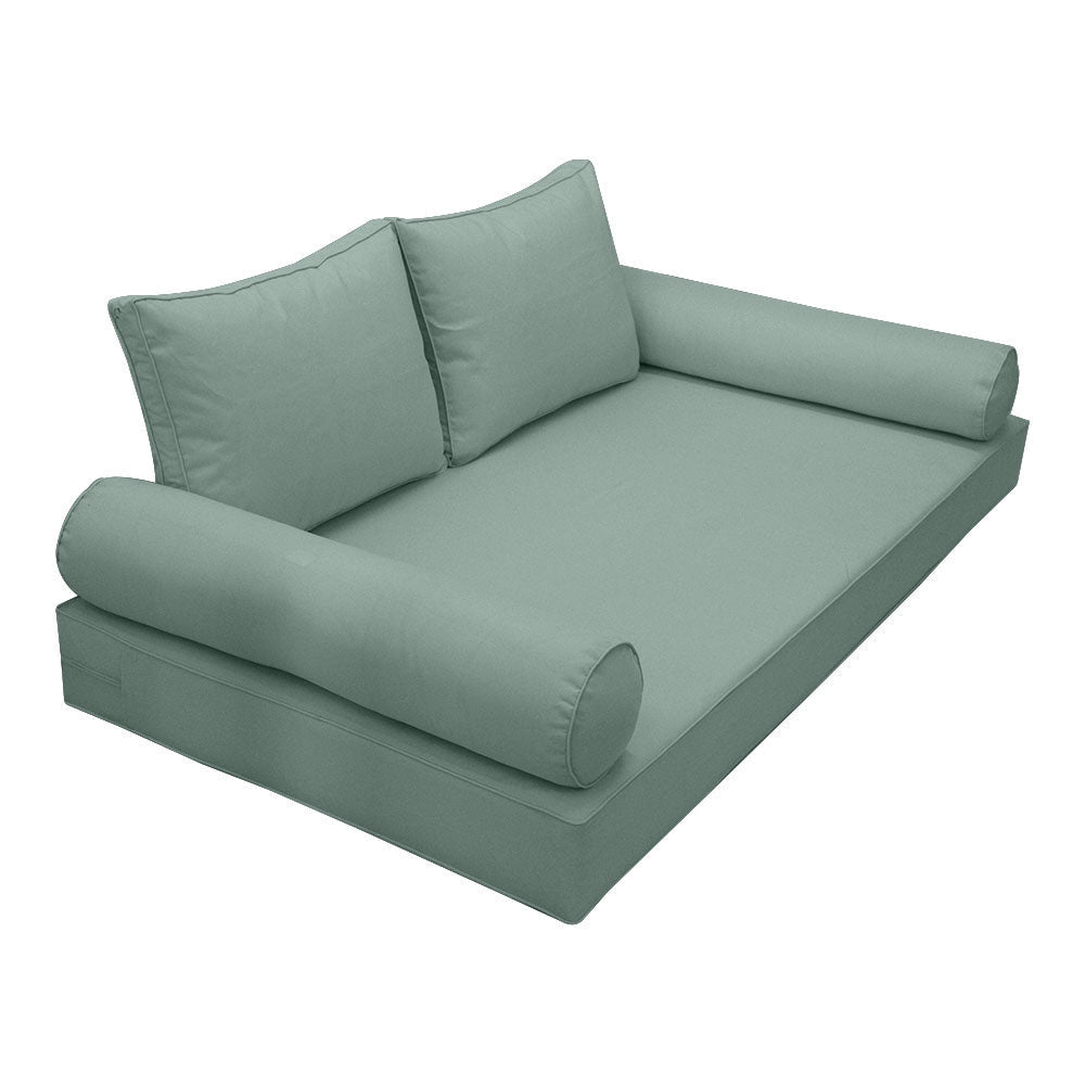 Elegant cushion and bolster set featuring refined craftsmanship and knife-edge detailing, designed for versatile indoor and outdoor comfort.
