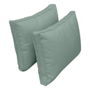 Pillow and bolster cushions displayed on an outdoor porch swing for a cozy, elegant setting.
