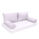 Elegant cushion and bolster set featuring refined craftsmanship and knife-edge detailing, designed for versatile indoor and outdoor comfort