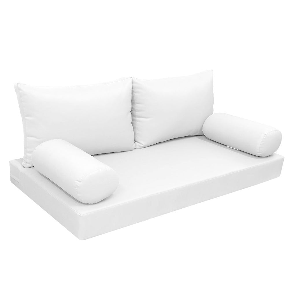 Elegant cushion and bolster set featuring refined craftsmanship and knife-edge detailing, designed for versatile indoor and outdoor comfort