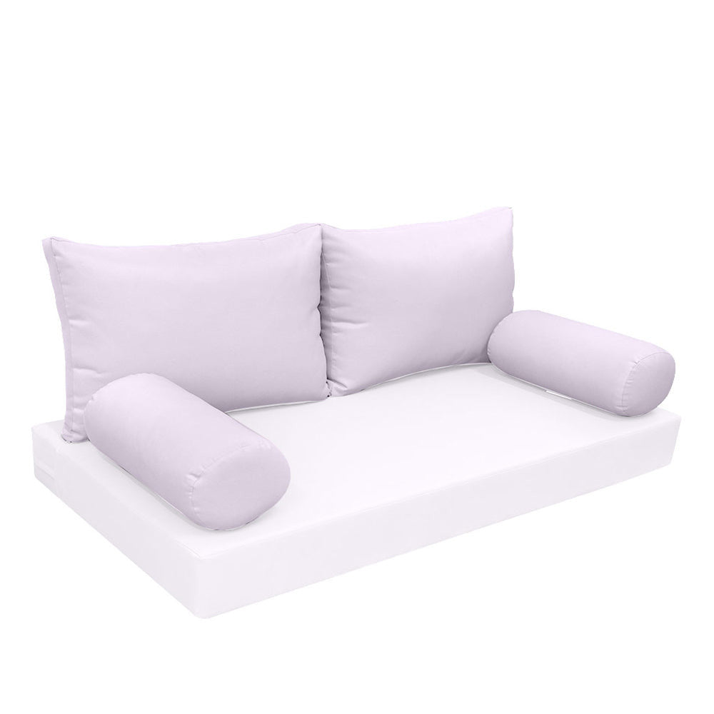 Elegant cushion and bolster set featuring refined craftsmanship and knife-edge detailing, designed for versatile indoor and outdoor comfort