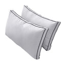 Pillow and bolster cushions displayed on an outdoor porch swing for a cozy, elegant setting.
