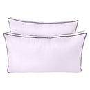 Pillow and bolster cushions displayed on an outdoor porch swing for a cozy, elegant setting.