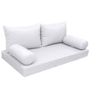 Elegant cushion and bolster set featuring refined craftsmanship and knife-edge detailing, designed for versatile indoor and outdoor comfort