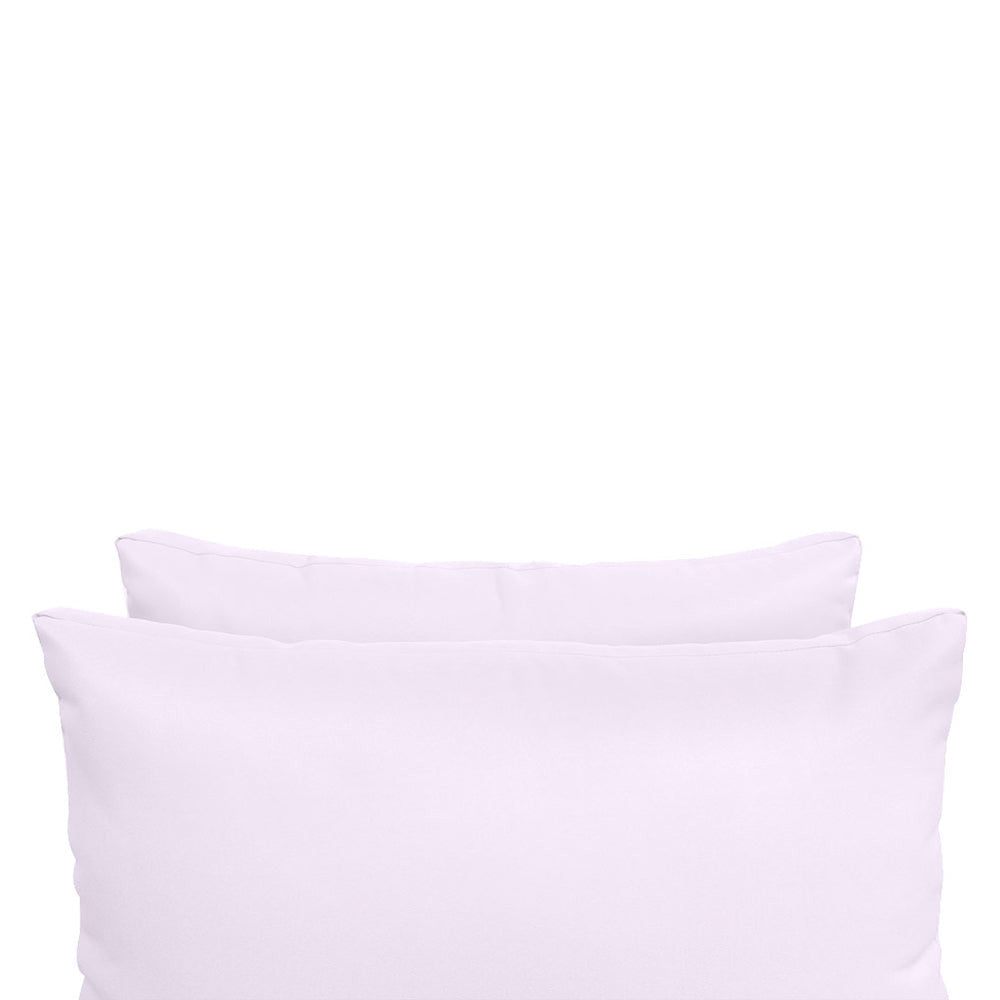 Pillow and bolster cushions displayed on an outdoor porch swing for a cozy, elegant setting