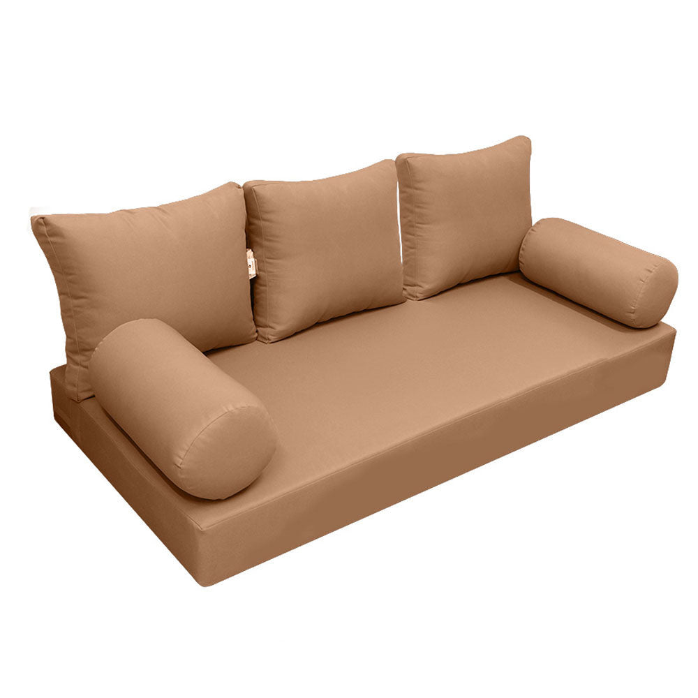 Elegant cushion and bolster set featuring refined craftsmanship and knife-edge detailing, designed for versatile indoor and outdoor comfort