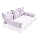 Elegant cushion and bolster set featuring refined craftsmanship and knife-edge detailing, designed for versatile indoor and outdoor comfort.
