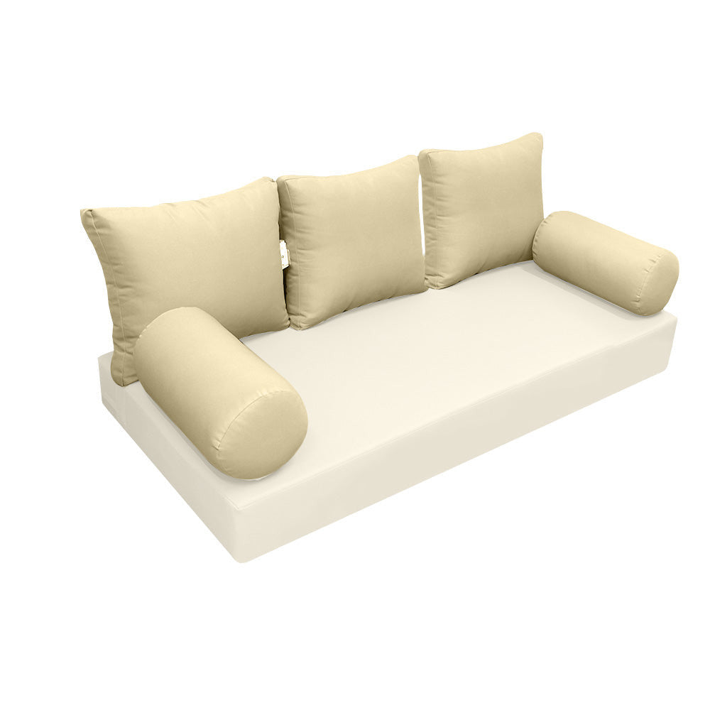 Elegant cushion and bolster set featuring refined craftsmanship and knife-edge detailing, designed for versatile indoor and outdoor comfort