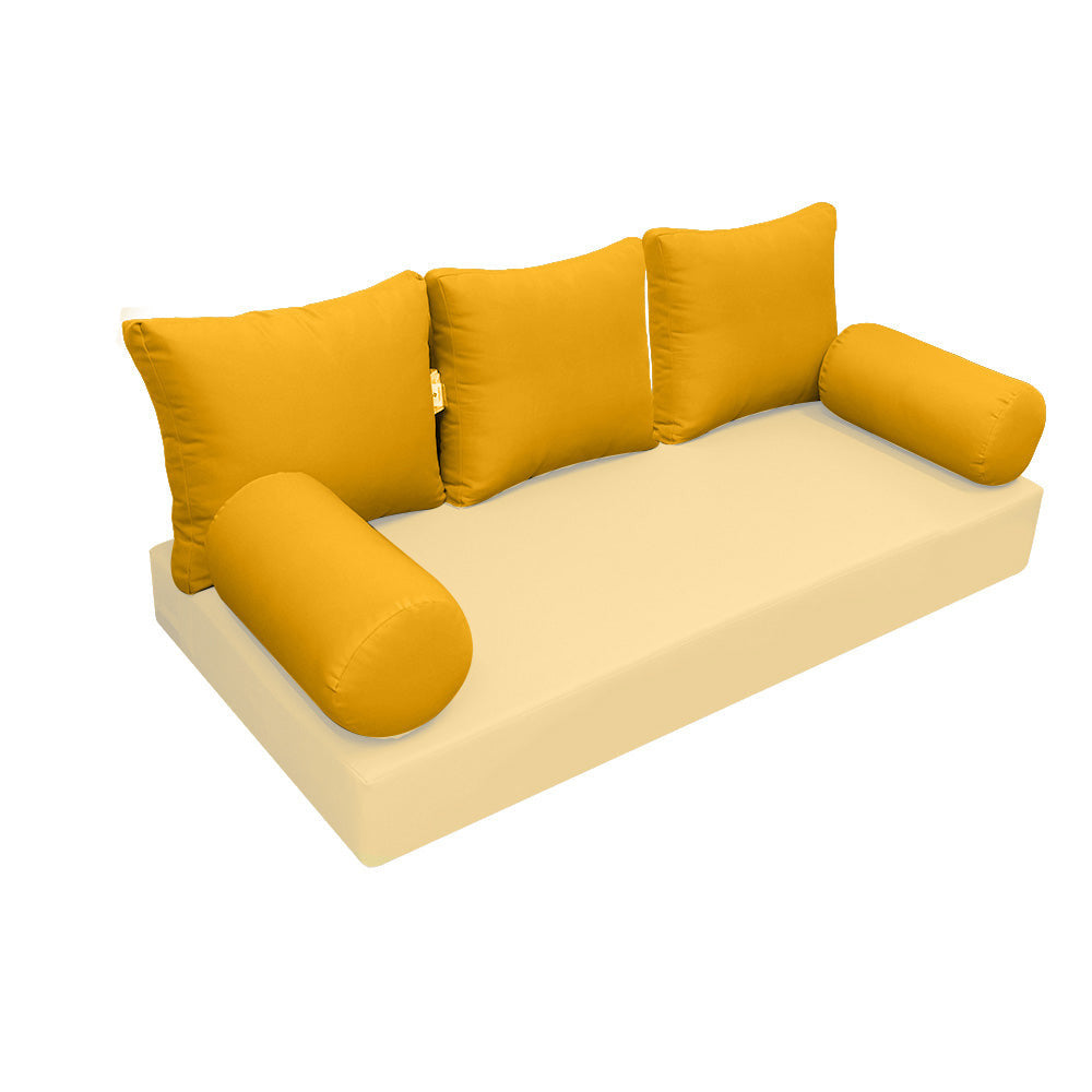 Elegant cushion and bolster set featuring refined craftsmanship and knife-edge detailing, designed for versatile indoor and outdoor comfort