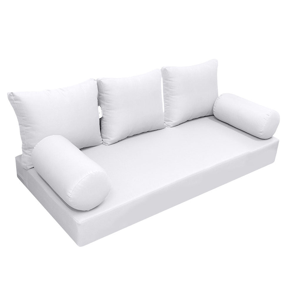 Elegant cushion and bolster set featuring refined craftsmanship and knife-edge detailing, designed for versatile indoor and outdoor comfort