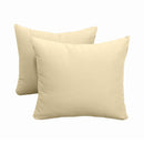 Pillow and bolster cushions displayed on an outdoor porch swing for a cozy, elegant setting.