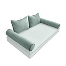 Elegant cushion and bolster set featuring refined craftsmanship and knife-edge detailing, designed for versatile indoor and outdoor comfort.