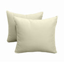 Pillow and bolster cushions displayed on an outdoor porch swing for a cozy, elegant setting.