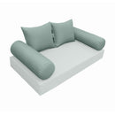Elegant cushion and bolster set featuring refined craftsmanship and knife-edge detailing, designed for versatile indoor and outdoor comfort.