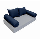 Elegant cushion and bolster set featuring refined craftsmanship and knife-edge detailing, designed for versatile indoor and outdoor comfort.